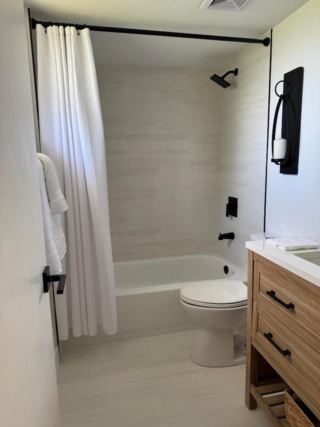 full bathroom featuring vanity, toilet, and shower / bath combination with curtain