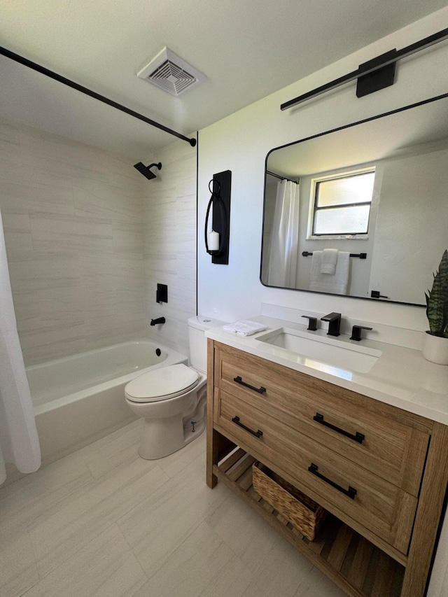 full bathroom featuring vanity, shower / tub combo with curtain, and toilet