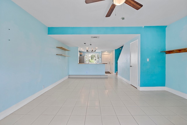 unfurnished living room featuring light tile patterned flooring and ceiling fan with notable chandelier