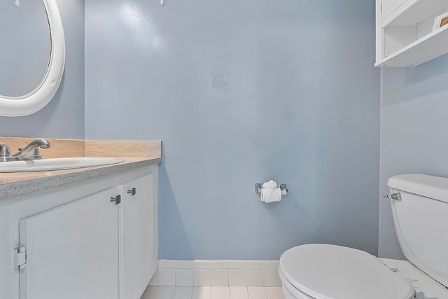 bathroom featuring vanity, toilet, and tile patterned floors