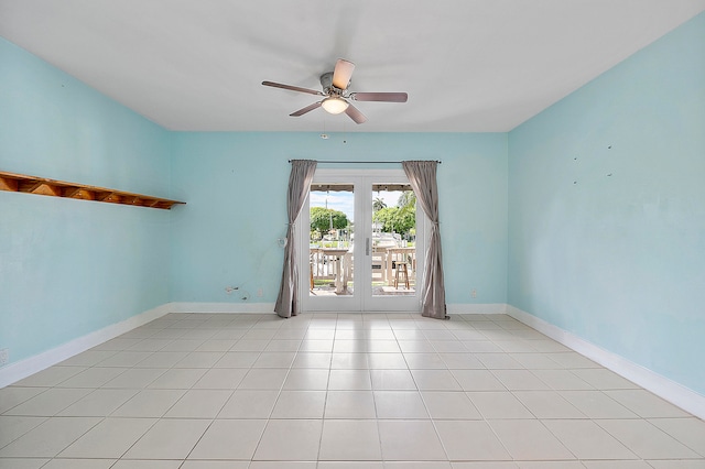 spare room with french doors, ceiling fan, and light tile patterned flooring