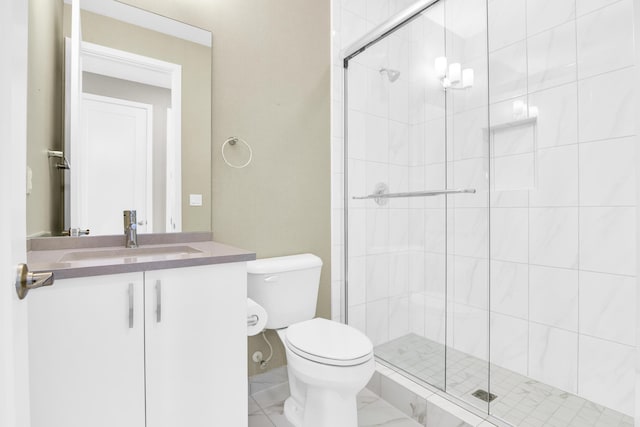 bathroom with a shower with door, vanity, and toilet