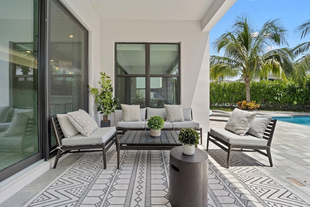 view of patio featuring a fenced in pool and an outdoor hangout area