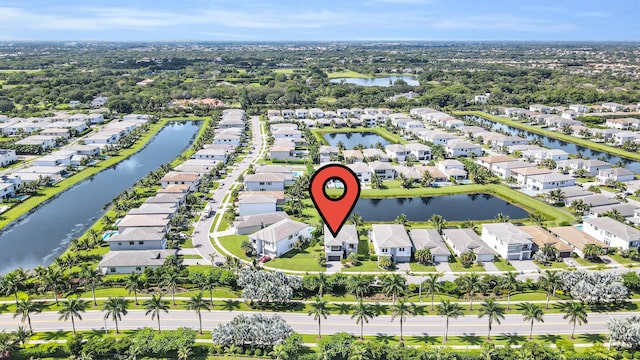 birds eye view of property featuring a water view