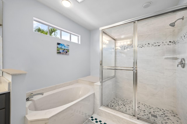 bathroom with vanity, tile patterned flooring, and plus walk in shower