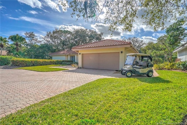 view of front of property with a garage and a front yard