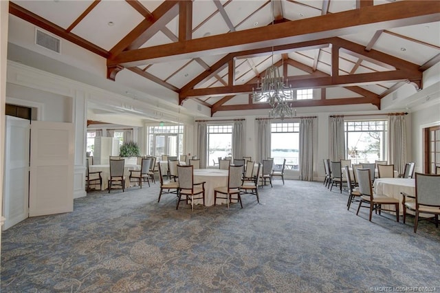 interior space with high vaulted ceiling, beam ceiling, and an inviting chandelier