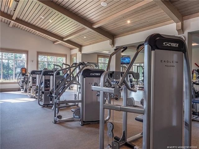 exercise room featuring carpet, vaulted ceiling, and wooden ceiling