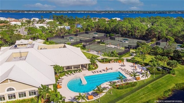 birds eye view of property with a water view