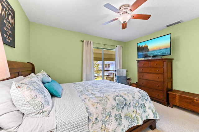 carpeted bedroom featuring ceiling fan