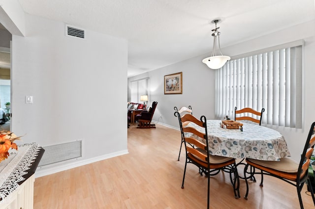 dining room featuring light wood-type flooring