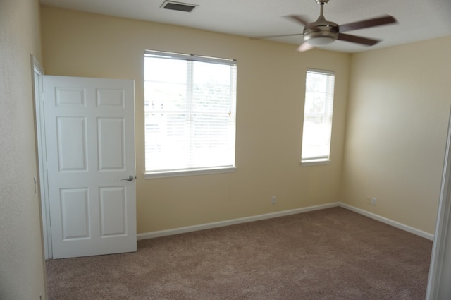 unfurnished room featuring carpet flooring and ceiling fan