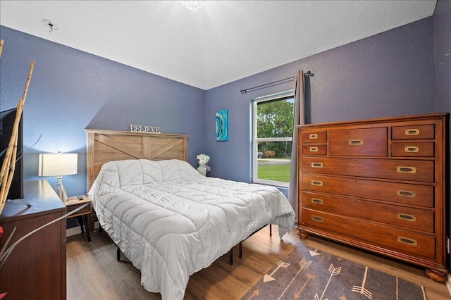 bedroom featuring dark wood-type flooring