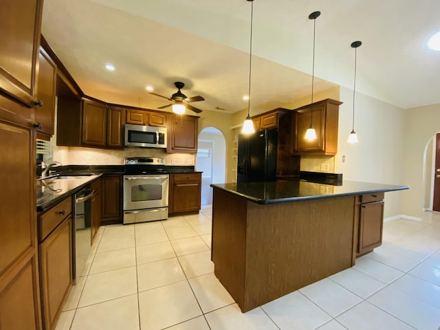 kitchen with decorative backsplash, sink, ceiling fan, and black appliances