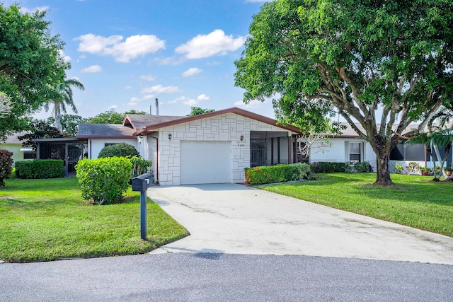 ranch-style house featuring a front yard and a garage