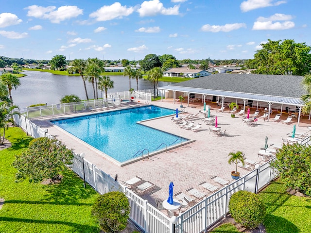 view of pool featuring a patio and a water view