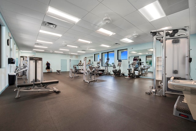 gym featuring a paneled ceiling