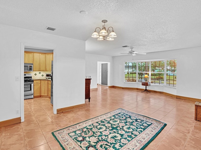 living room featuring a textured ceiling, ceiling fan with notable chandelier, and light tile patterned floors