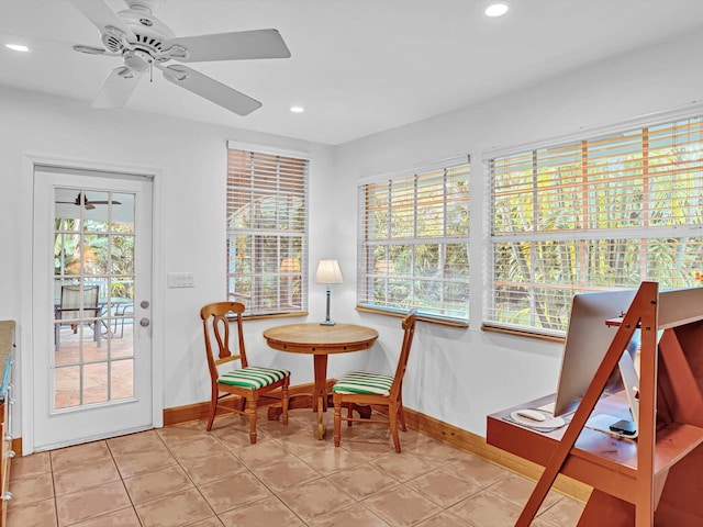 sitting room featuring ceiling fan, a healthy amount of sunlight, and light tile patterned floors