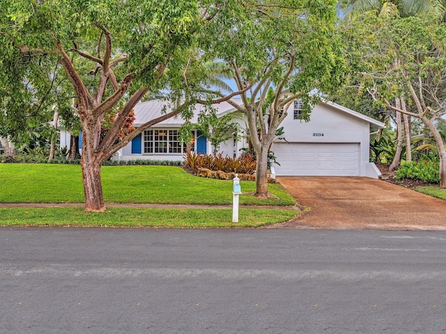 single story home featuring a front yard and a garage