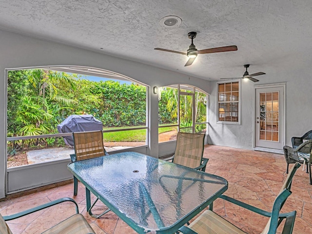 view of patio with a grill and ceiling fan