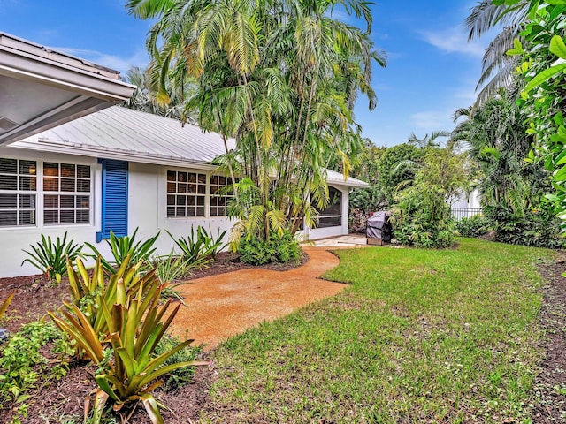 view of yard featuring a sunroom