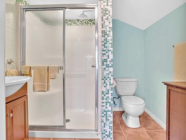 bathroom with vanity, toilet, and an enclosed shower