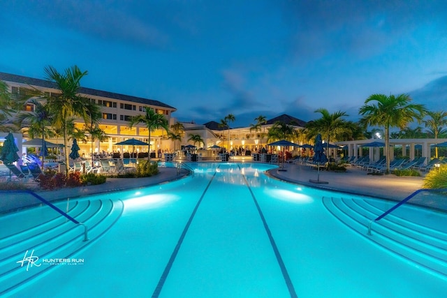 view of pool at dusk