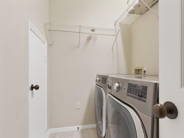 laundry room with washer and dryer