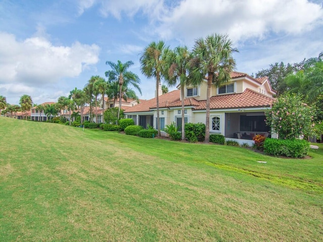 view of yard with a sunroom