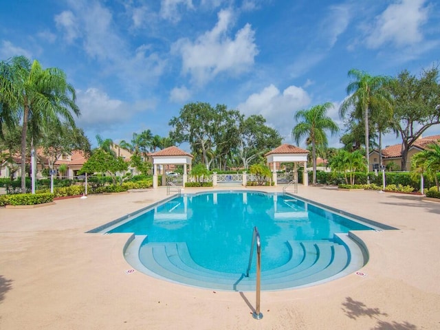 view of swimming pool with a gazebo and a patio area