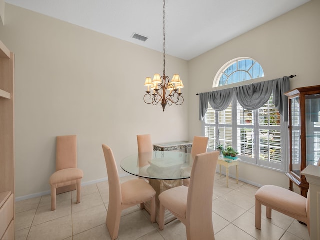 dining space featuring an inviting chandelier and light tile patterned floors