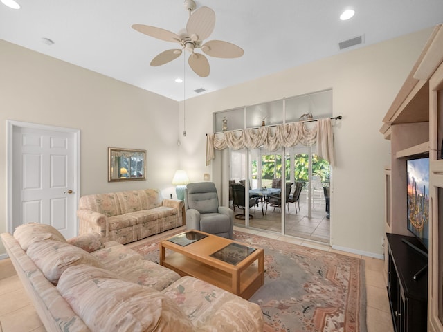 tiled living room with ceiling fan