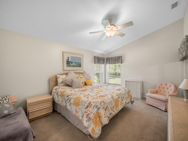 carpeted bedroom with vaulted ceiling and ceiling fan