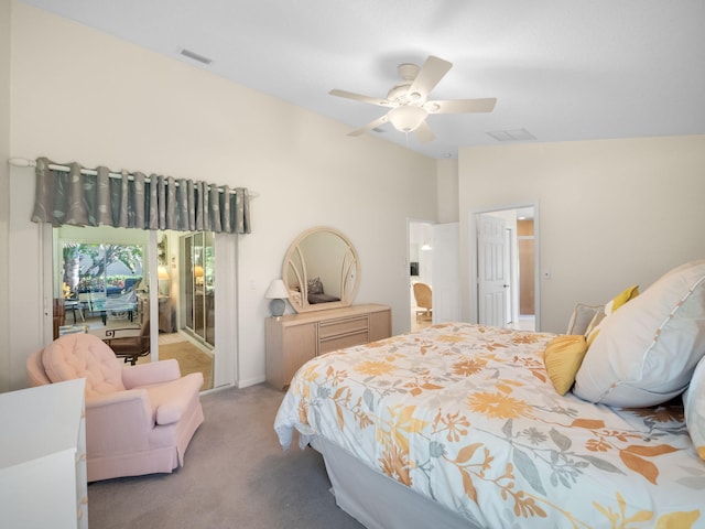 carpeted bedroom featuring lofted ceiling and ceiling fan