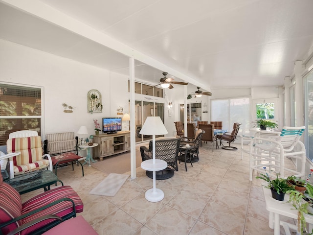 sunroom with vaulted ceiling and ceiling fan