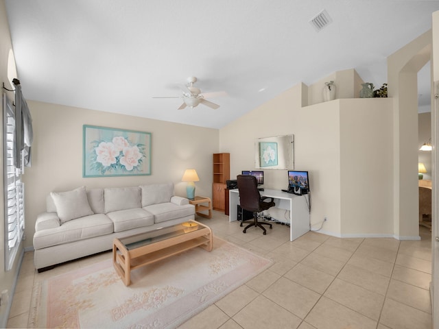 living room featuring vaulted ceiling, light tile patterned floors, and ceiling fan