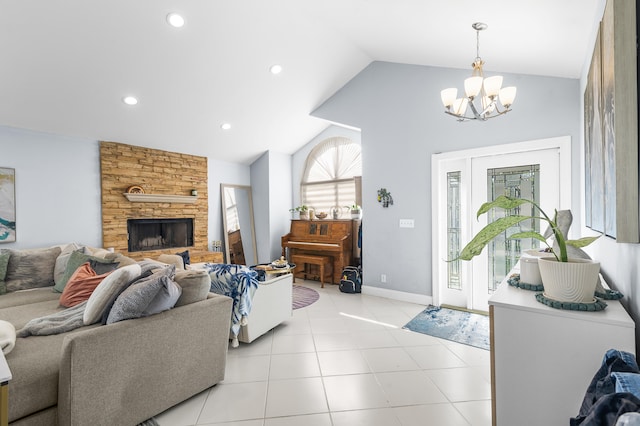 living room with lofted ceiling, light tile patterned floors, a fireplace, and a chandelier