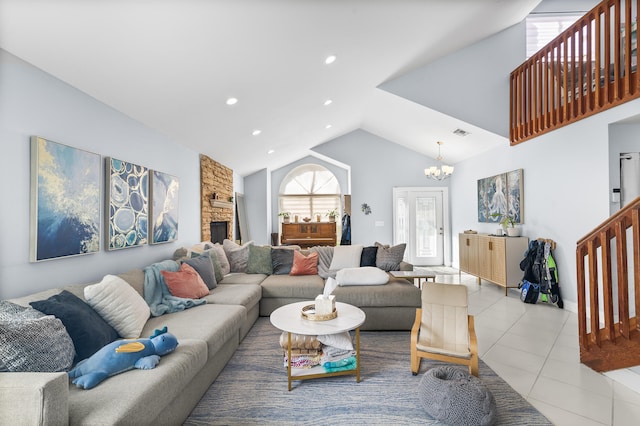 tiled living room featuring lofted ceiling, a chandelier, and a fireplace