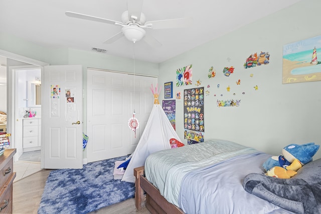 bedroom with ceiling fan, a closet, and light wood-type flooring