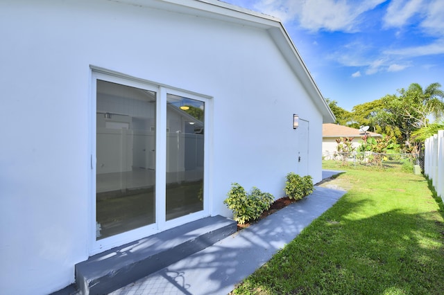 view of home's exterior featuring a lawn