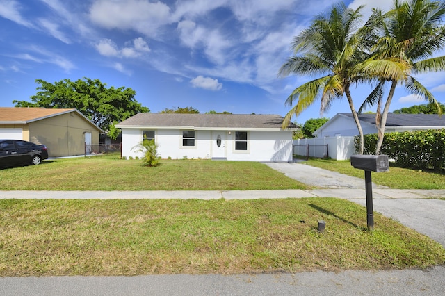 ranch-style house with a front lawn