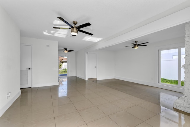 tiled spare room with a wealth of natural light