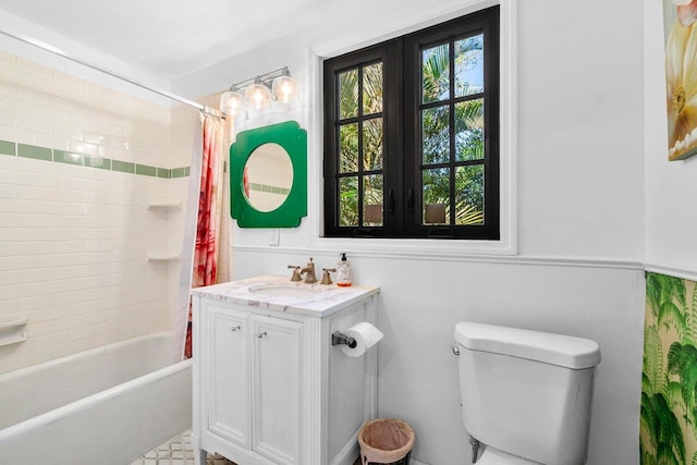 bathroom featuring vanity, toilet, and shower / tub combo with curtain