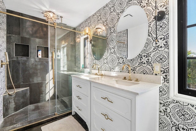 full bathroom featuring a sink, visible vents, and a shower stall