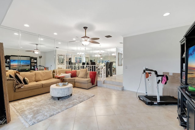 living room with light tile patterned flooring and ceiling fan with notable chandelier