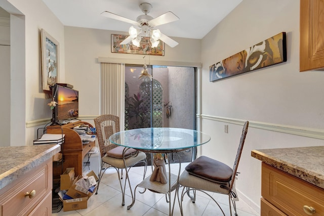 dining area with ceiling fan and light tile patterned floors