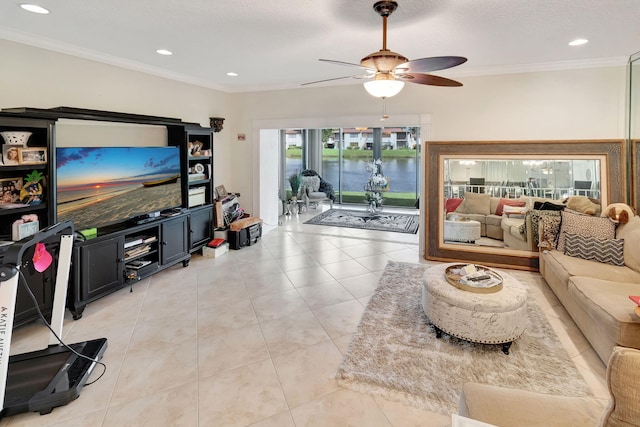 living room featuring crown molding, light tile patterned floors, and ceiling fan