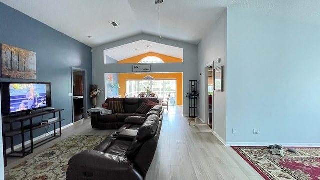 living room with light wood-type flooring and lofted ceiling