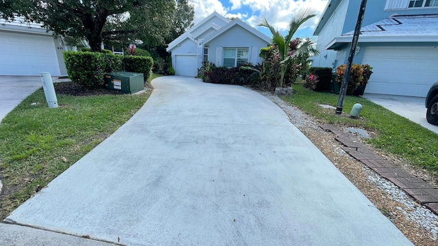 exterior space with a garage and a yard